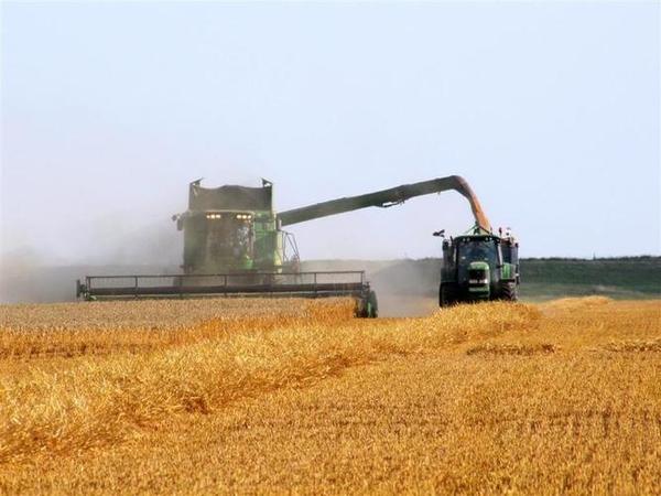 John_Deere_combine_and_tractor_at_work__Large_